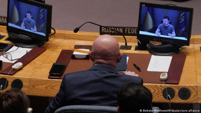 Russian Ambassador to the UN Vasily Nebenzya listens to Volodymyr Zelenskyy's speech