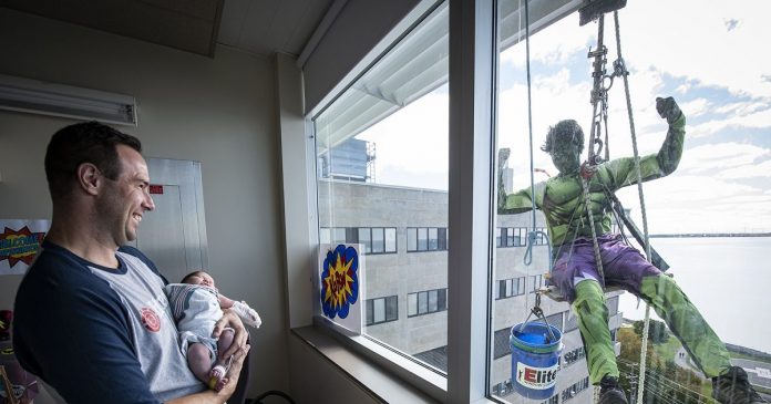 May happiness come on the faces of sick children... so come the window cleaners by becoming superheroes

